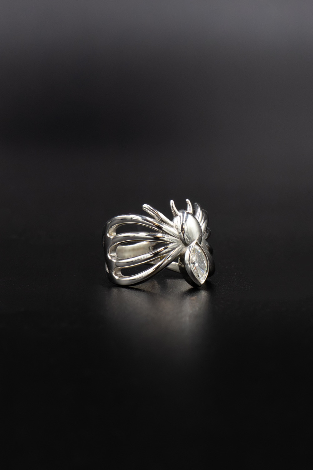 Spider ring: a marquise white diamond set in fine drawn silver claws