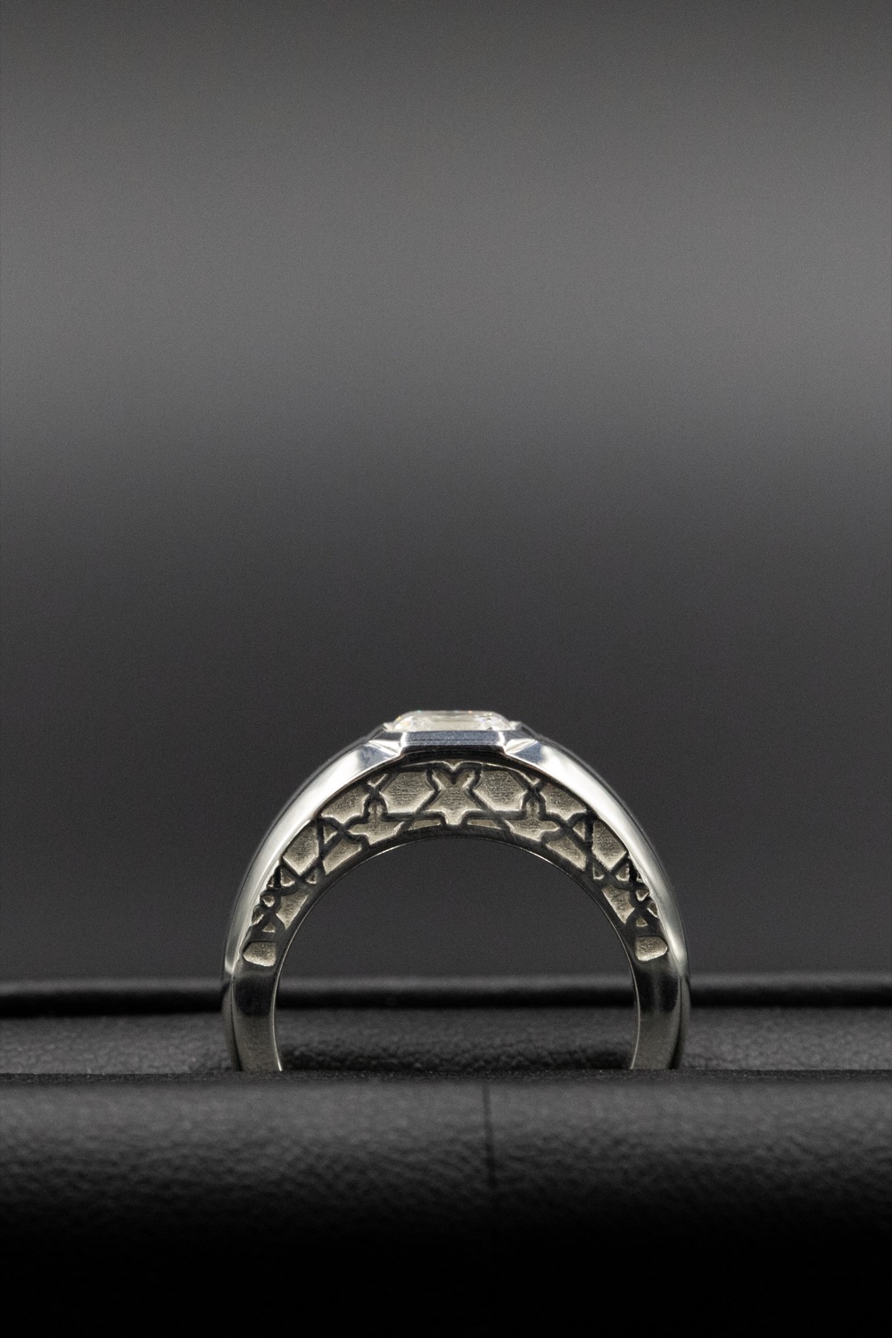Asscher-cut diamond signet ring with an Alhambra-motif pierced gallery