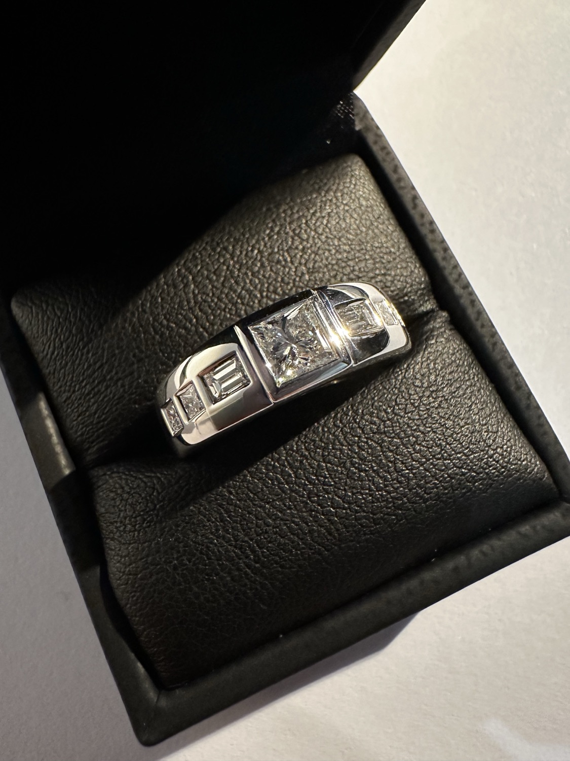 Princess-cut diamond engagement ring remodel with baguette and princess accents in white gold